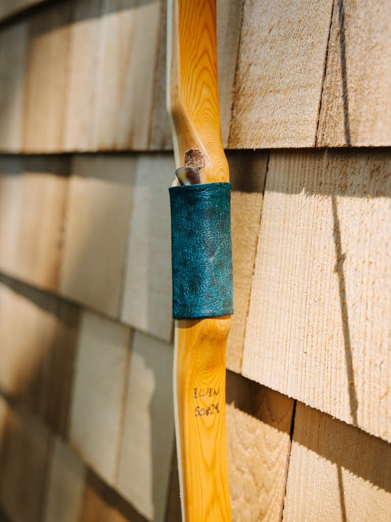 Teal leather grip on one of the BC handmade bows from the Oshosi rack